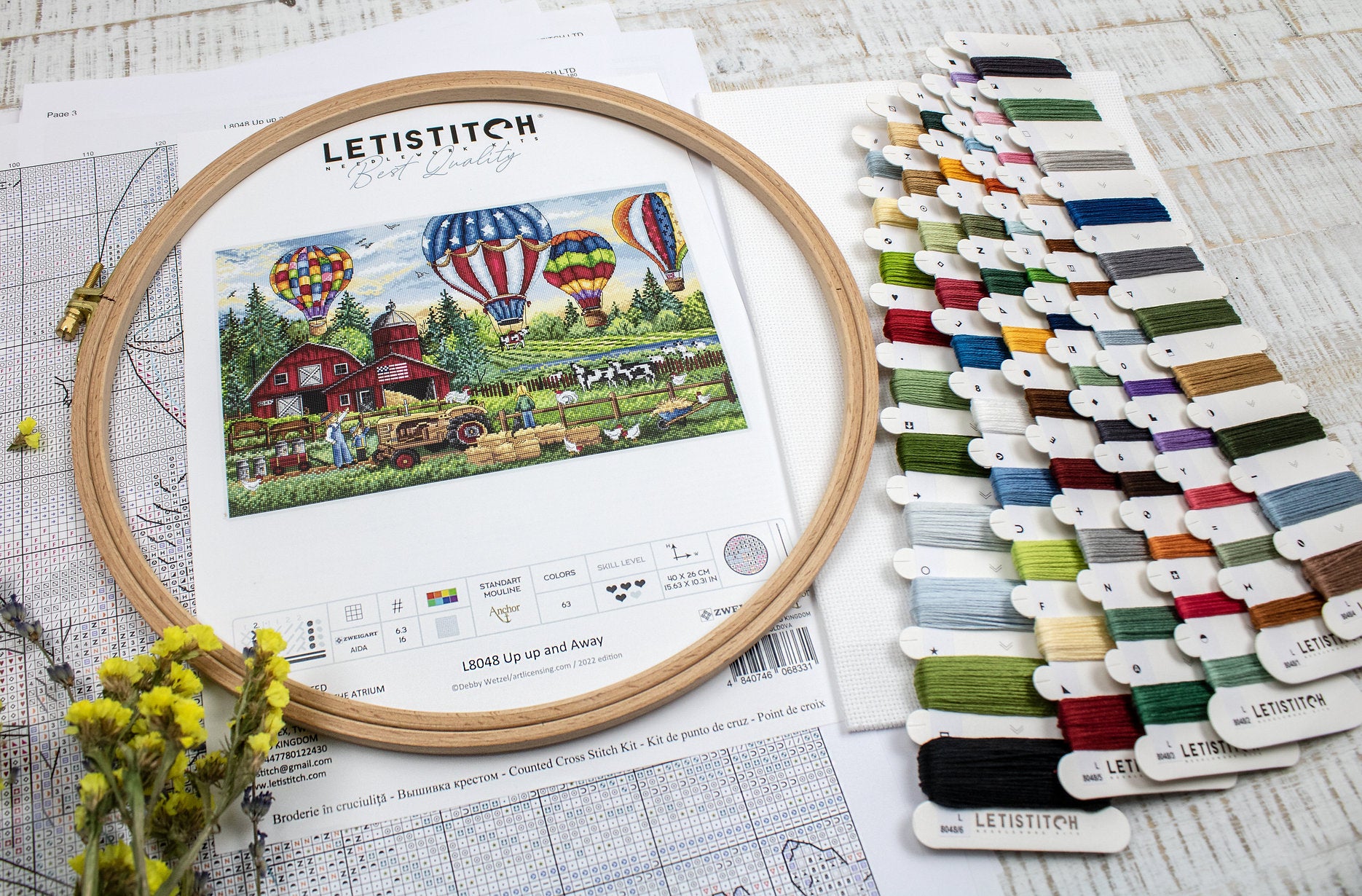 Up Up and Away L8048 Counted Cross Stitch Kit featuring colorful threads, Aida canvas, and detailed instruction chart.